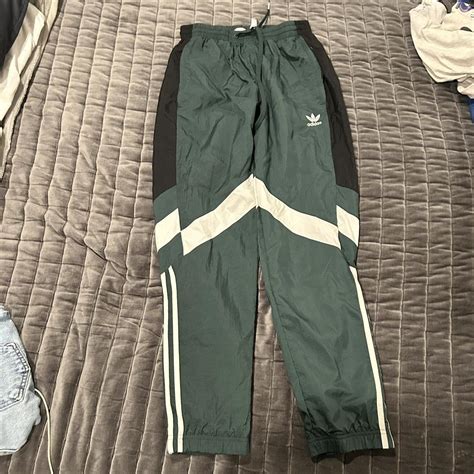 forest green adidas tracksuit.